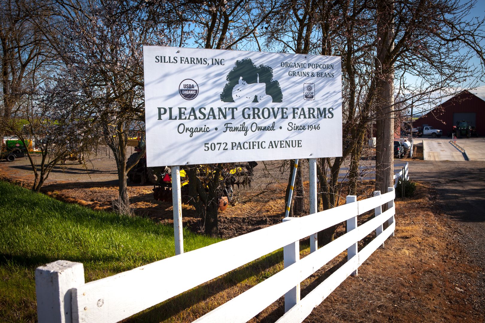 Harvest equipment working organic fields at Pleasant Grove Farms